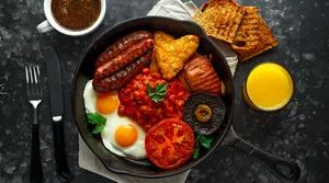 Full English breakfast with sausages, bacon, homemade hash browns and a fried egg
