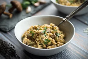 Creamy mushroom risotto garnished with fresh herbs
